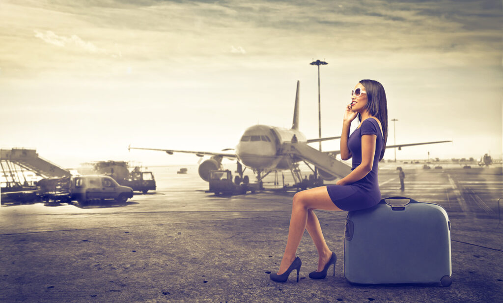 Woman Sitting On Suitcase Plane